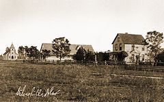 Mission Church, Peoples Supply, and Oscar Johnson Home about 1907-1908, looking SE.
